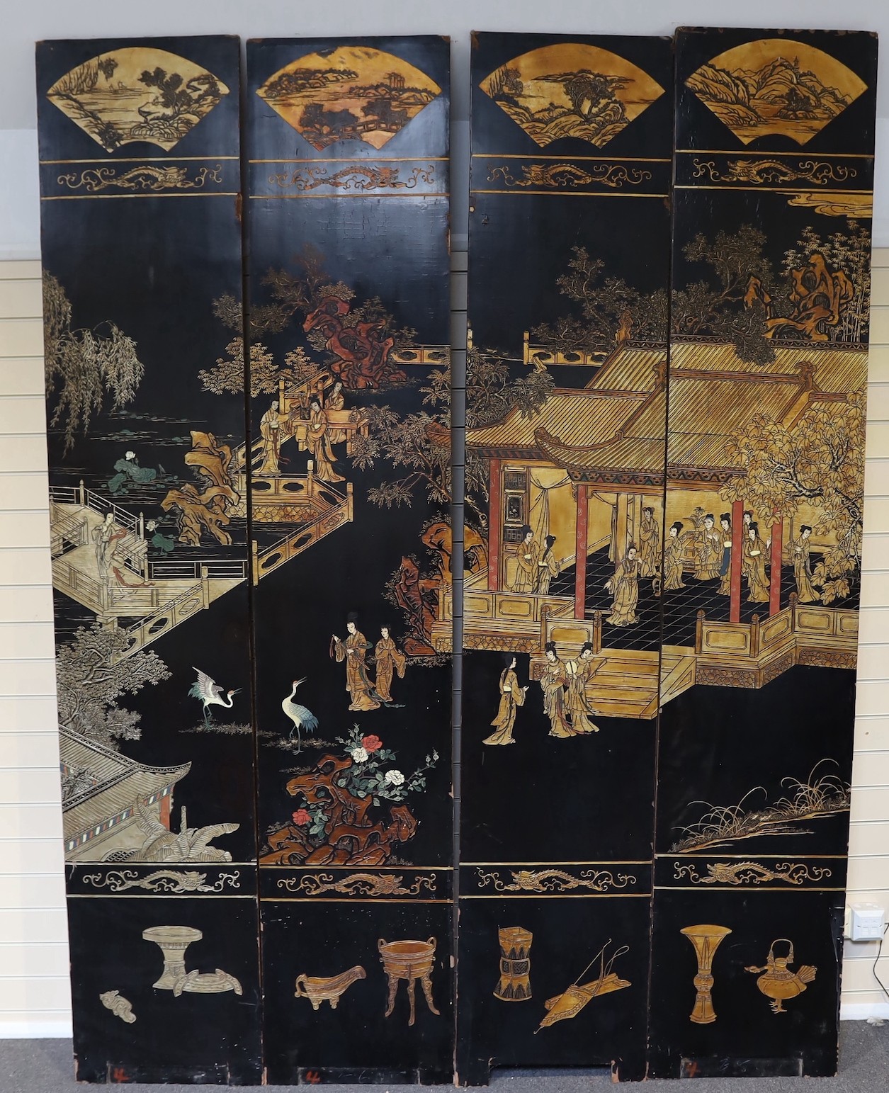 A tall Chinese coromandel lacquer twelve panel screen, 19th century, each leaf panel width 49cm, height 264cm